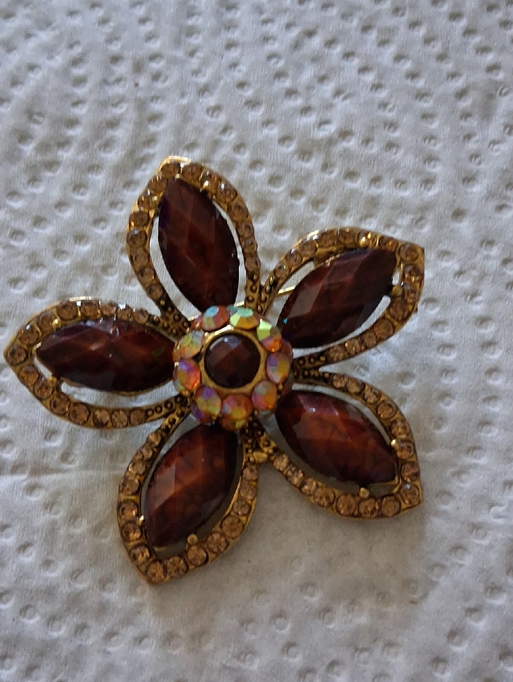 Gold-Tone Brown Crystal Flower Brooch with Iridescent Center